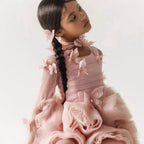Close-up of the high collar, petal appliques and sheer rhinestone sleeve on the dusty rose gown.