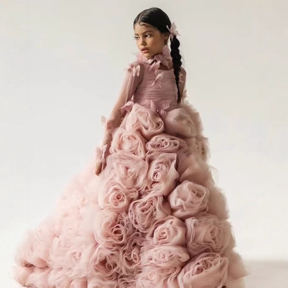 Dusty rose organza girls formal dress covered in rosettes, front view, for a stage performance.