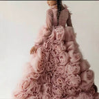 Rosette covered skirt on the dusty rose princess dress for girls, angled side view.