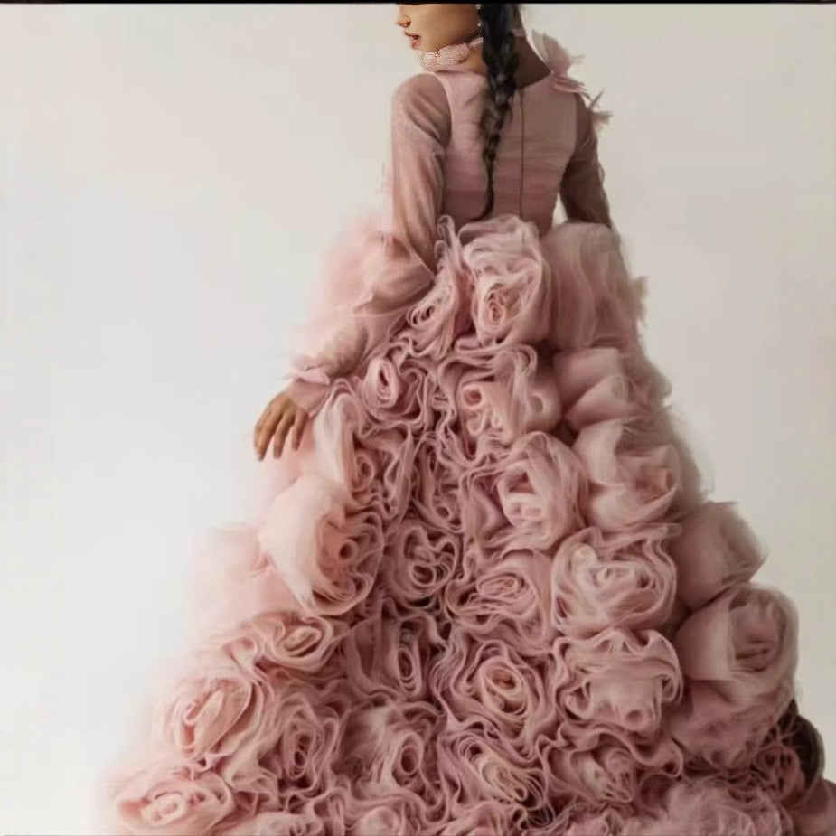 Rosette covered skirt on the dusty rose princess dress for girls, angled side view.