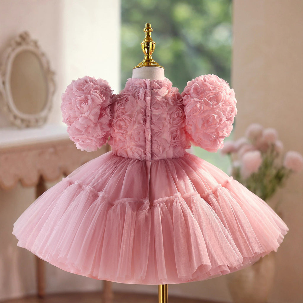 Back view of the dusty rose girls party dress showing the zip fastening and the full tulle skirt.