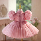 Back view of the dusty rose girls party dress showing the zip fastening and the full tulle skirt.