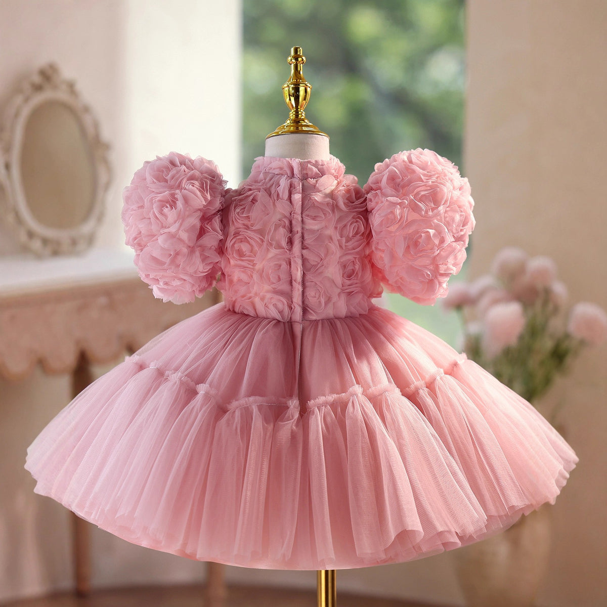 Back view of the dusty rose girls party dress showing the zip fastening and the full tulle skirt.