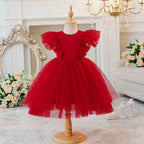 Red tulle flower girl dress with flutter sleeves and a full tulle skirt, front view, for a ceremony.