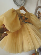 Golden yellow tulle girls tutu dress with sheer long puff sleeves and beaded rosettes, designed for birthdays and weddings.
