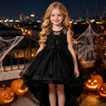 Black tulle girls high-low dress with a beaded bodice and large back bow, designed for Halloween parties.