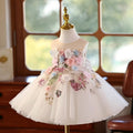 Ivory tulle flower girl dress with 3D floral appliqué across the bodice and skirt, front view, for weddings and ceremonies.
