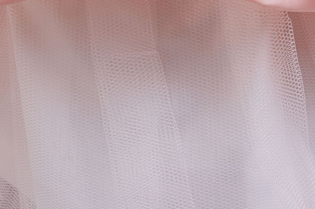 Pink lace and tulle girls gown with soft layered tulle skirt, designed for weddings and flower girls.