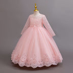 Pink lace and tulle girls gown with long lace sleeves and a floral waist, designed for weddings and flower girls.