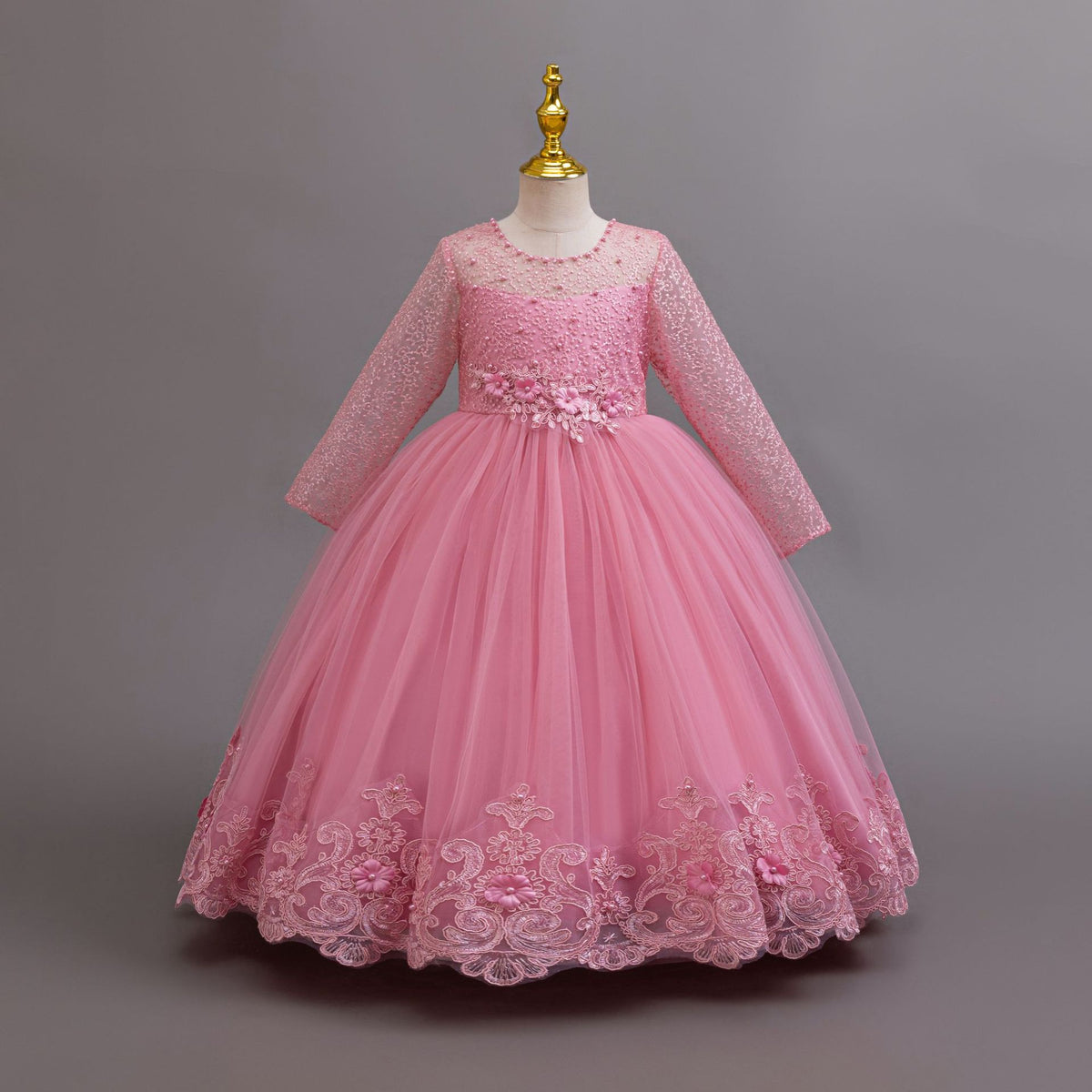 Mauve lace and tulle girls gown with long lace sleeves and a floral pearl waist, designed for weddings and flower girls.