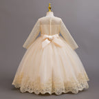 Champagne lace and tulle girls gown with a satin back bow and lace hem, designed for weddings and flower girls.
