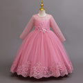 Mauve lace and tulle girls gown with long lace sleeves, a pearl-beaded bodice and a lace hem, designed for weddings and flower girls.