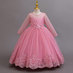 Mauve lace and tulle girls gown with long lace sleeves, a pearl-beaded bodice and a lace hem, designed for weddings and flower girls.