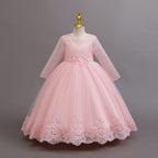 Pink lace and tulle girls gown with long lace sleeves, a pearl-beaded bodice and a lace hem, designed for weddings and flower girls.