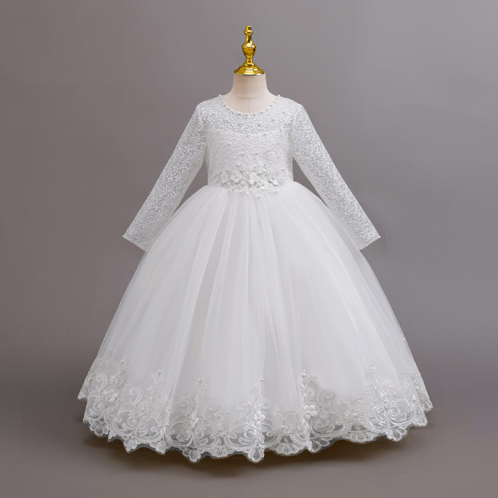 White lace and tulle girls gown with long lace sleeves, a pearl-beaded bodice and a lace hem, designed for weddings and flower girls.