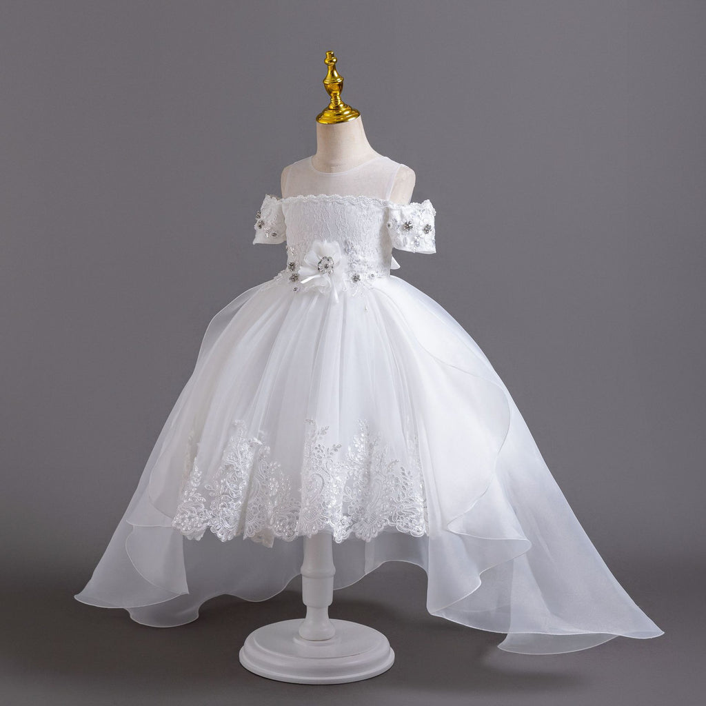 White lace girls gown with sheer mesh yoke and lace-trimmed tulle skirt, designed for weddings and first communion.