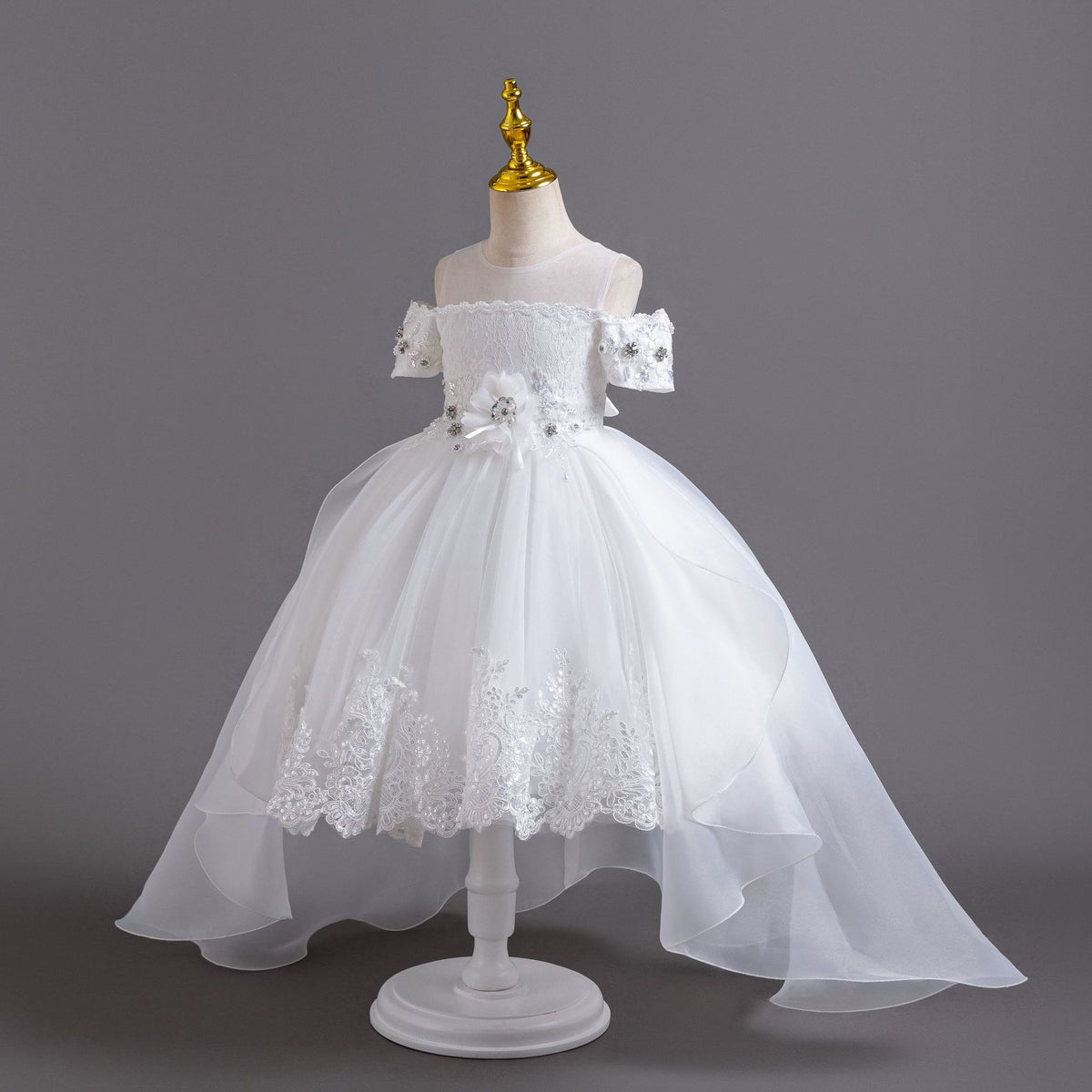 White lace girls gown with sheer mesh yoke and lace-trimmed tulle skirt, designed for weddings and first communion.