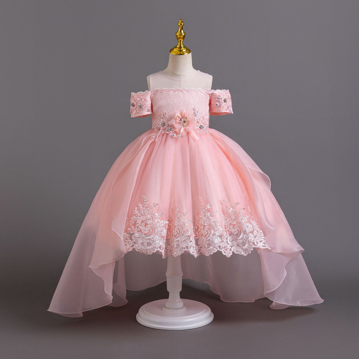Pink lace girls gown with beaded short sleeves and flower waist, designed for flower girls and birthday parties.