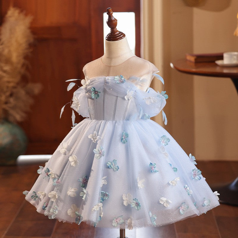 Light blue glitter tulle girls party dress with scattered 3D flowers and a full ball skirt, styled front view, for a birthday celebration.