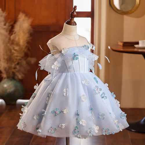 Light blue floral princess dress for girls with puff off-shoulder sleeves and a full tulle skirt, side angle, for a wedding party.