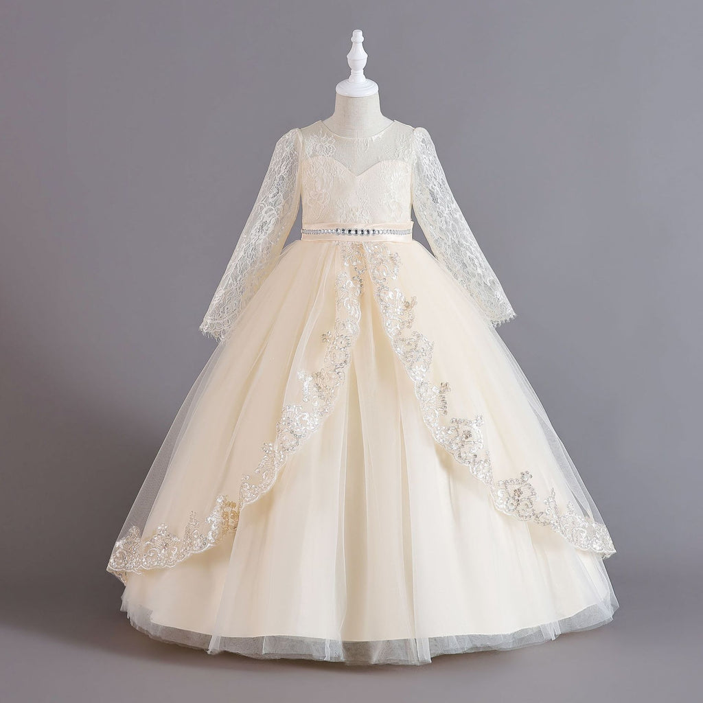 Champagne lace and tulle girls ball gown with long sheer lace sleeves, sequin lace overlay trim and rhinestone waistband, designed for weddings and Christmas.