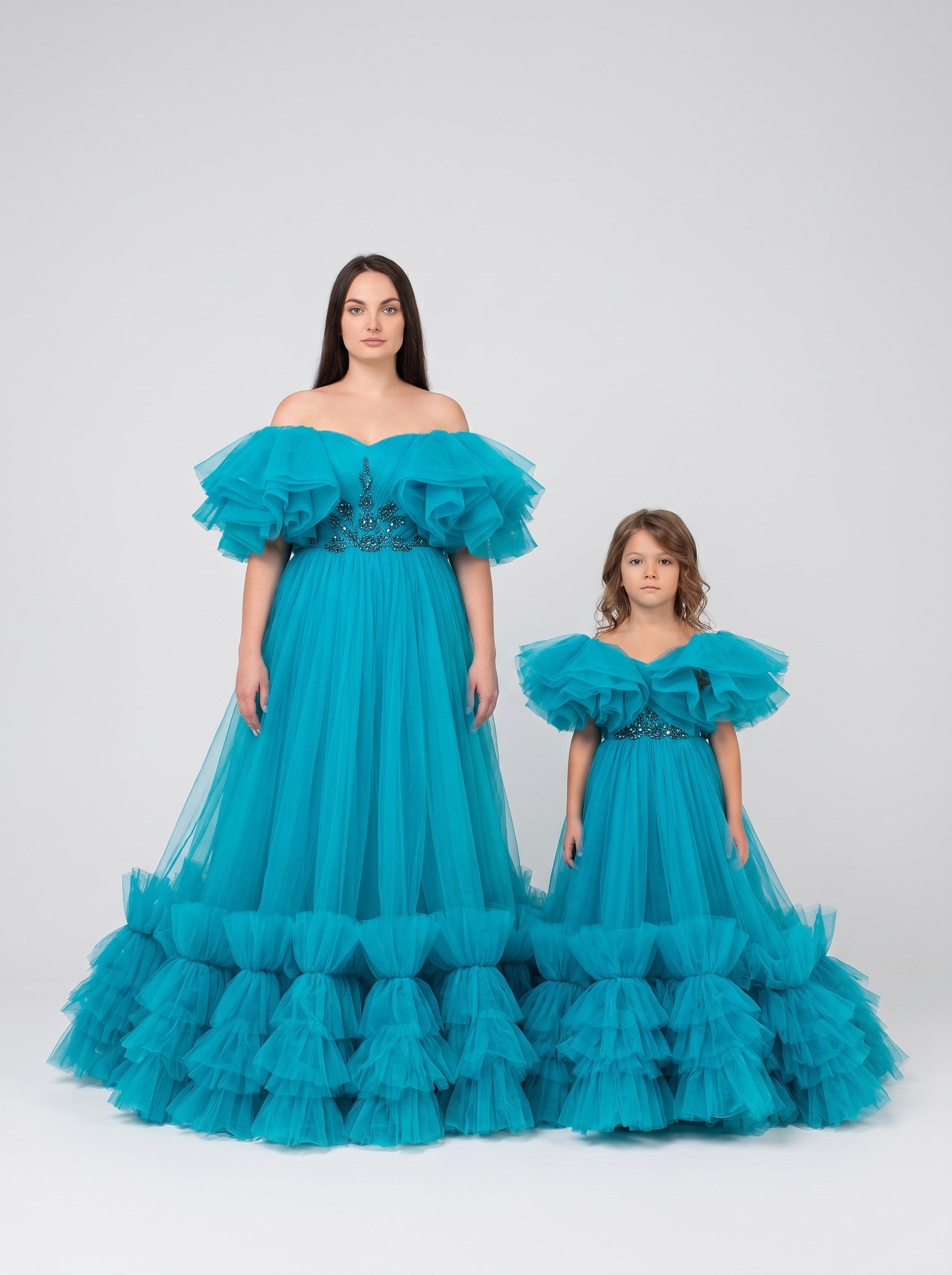 Mommy and daughter matching teal tulle ruffle gowns with train