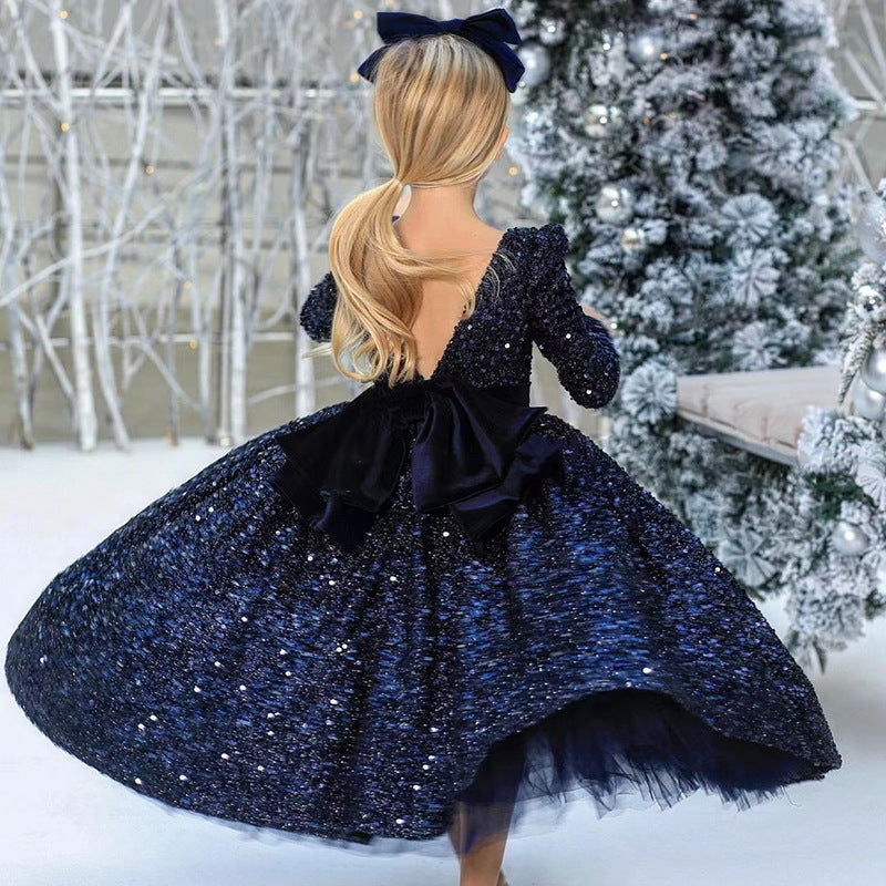 Navy sequin girls dress with long sleeves, open V-back and satin bow, designed for Christmas and holiday parties, view 2