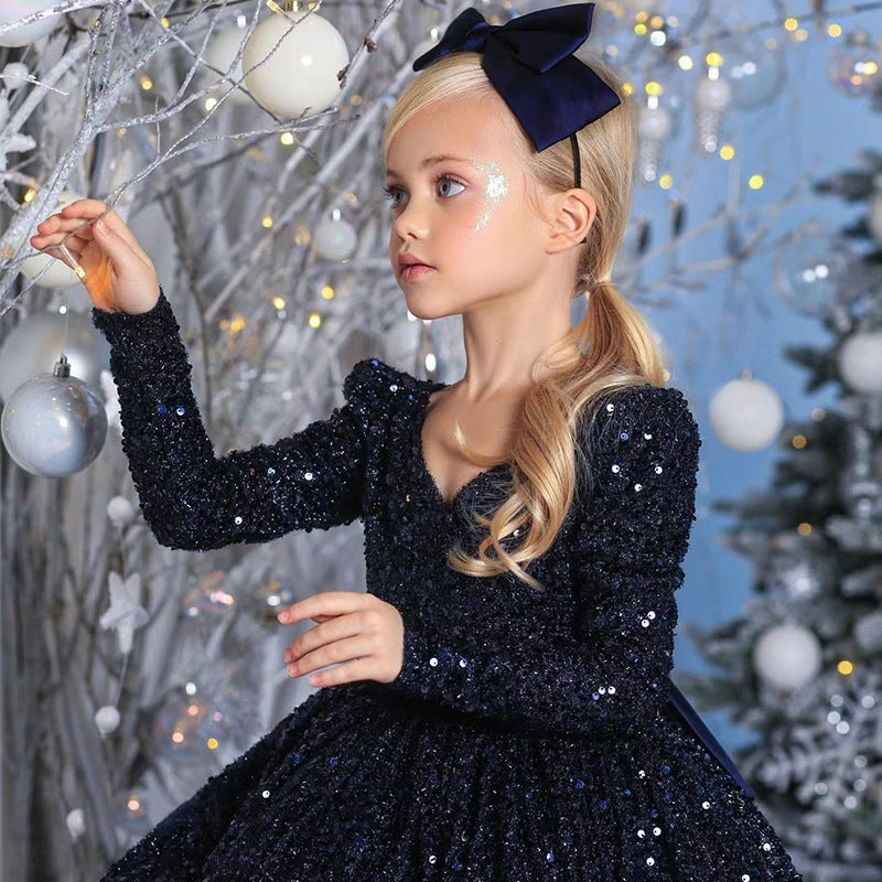 Navy sequin girls dress with long sleeves, open V-back and satin bow, designed for Christmas and holiday parties, view 4