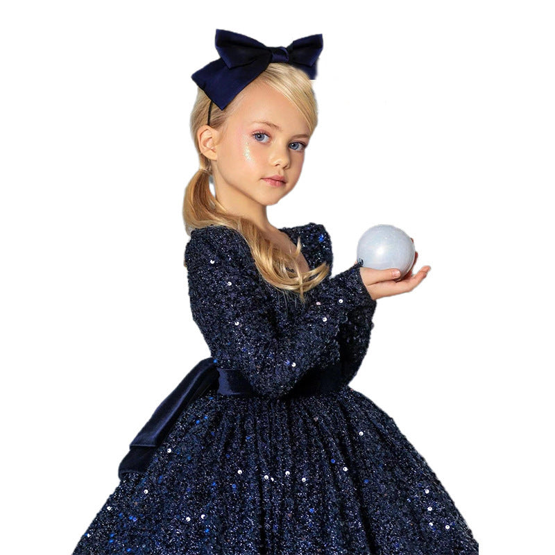 Navy sequin girls dress with long sleeves, open V-back and satin bow, designed for Christmas and holiday parties, view 5