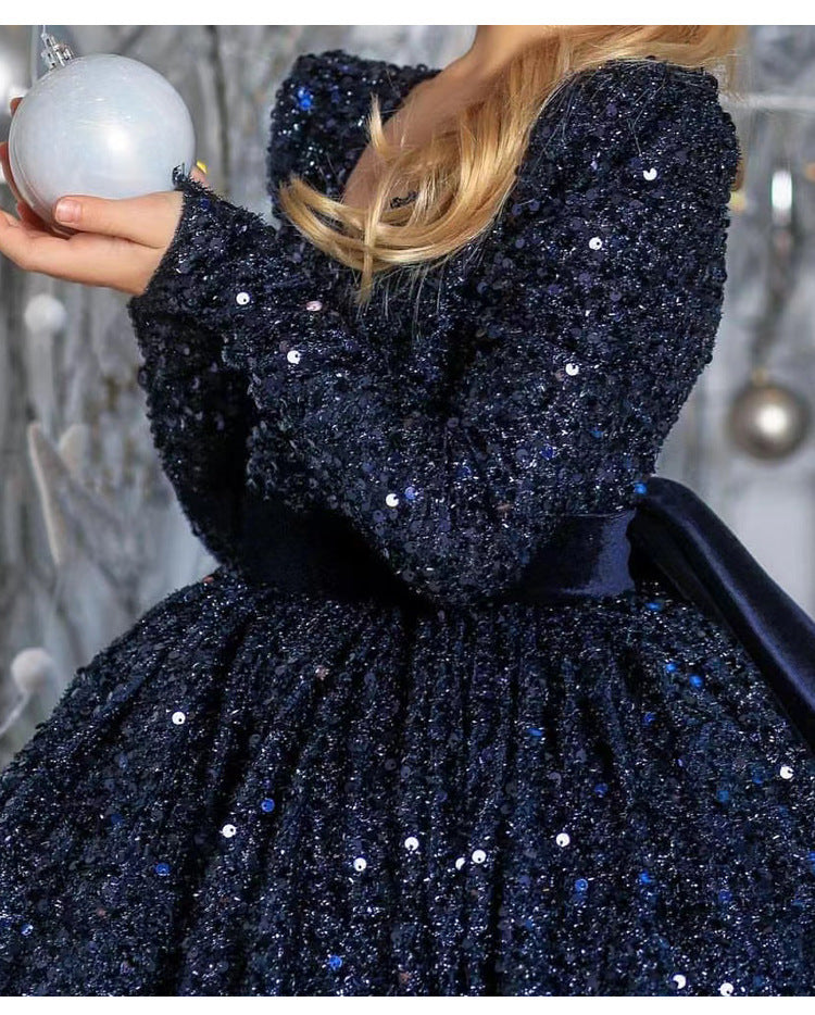 Navy sequin girls dress with long sleeves, open V-back and satin bow, designed for Christmas and holiday parties, view 7
