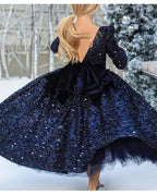 Navy sequin girls dress with long sleeves, open V-back and satin bow, designed for Christmas and holiday parties, view 9