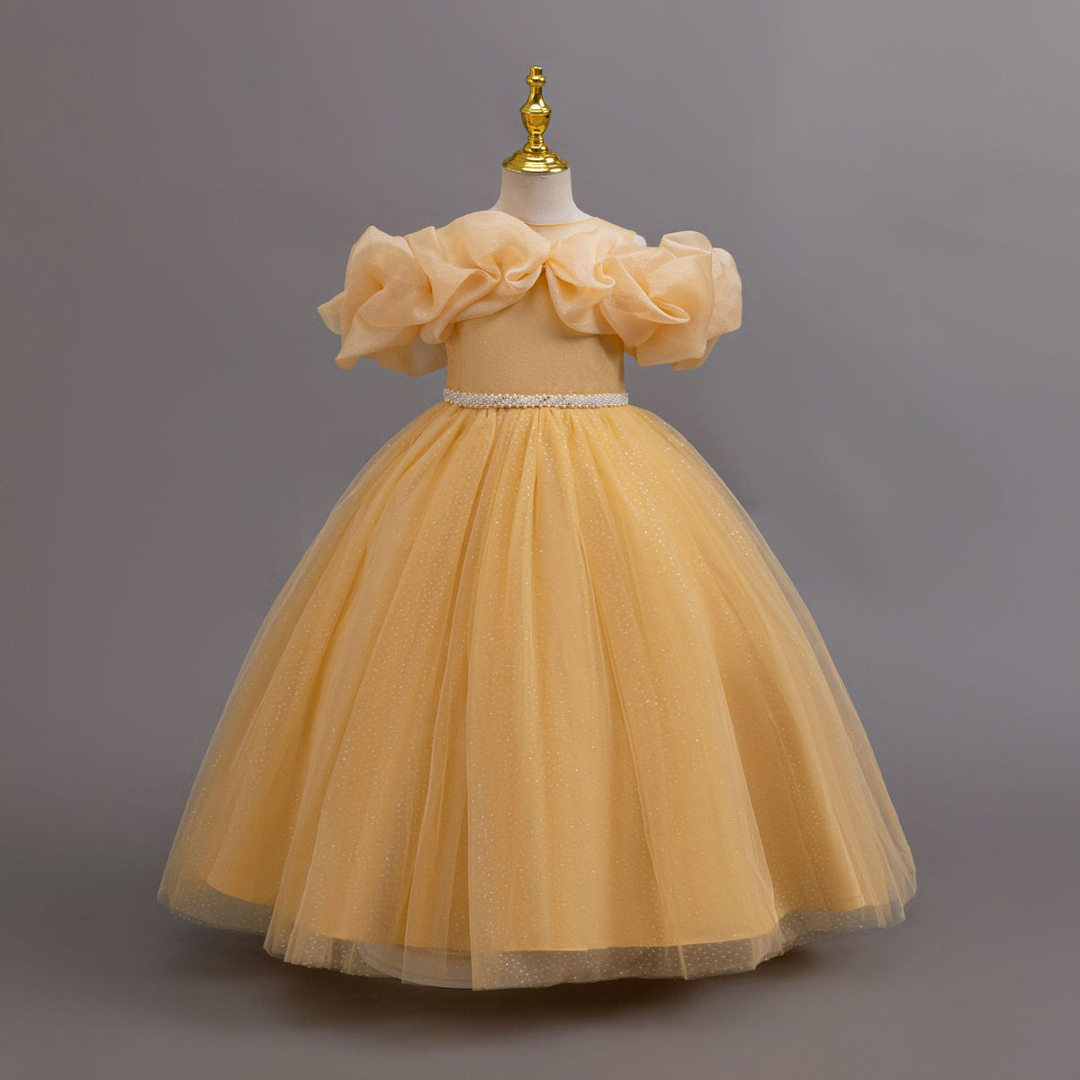 Gold glitter tulle girls ball gown with an off-shoulder ruffle neckline, pearl beaded waist and back bow, designed for birthdays, weddings and flower girls, view 3