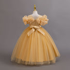 Gold glitter tulle girls ball gown with a satin bow and zipper at the back, off-shoulder ruffles and full ball gown skirt, designed for birthdays, weddings and flower girls.
