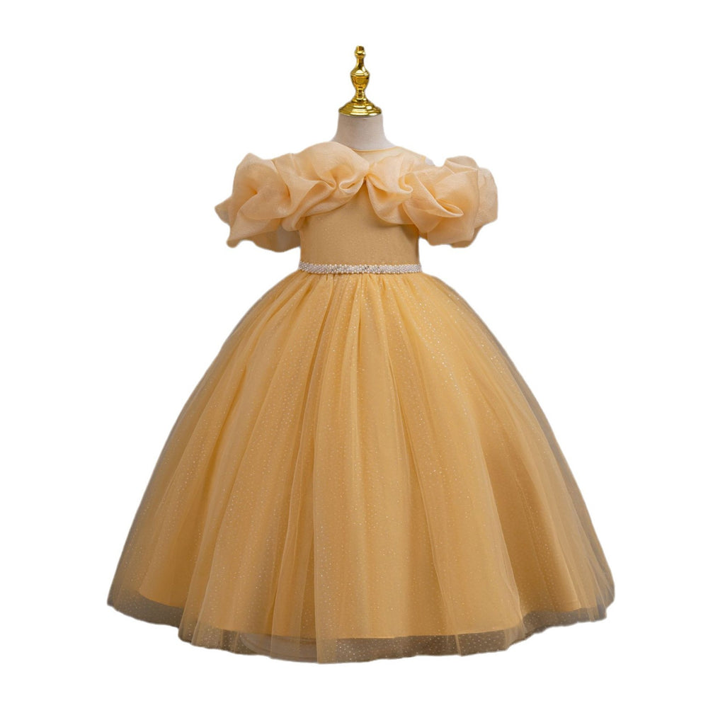 Gold glitter tulle girls ball gown with an off-shoulder ruffle neckline, pearl beaded waist and back bow, designed for birthdays, weddings and flower girls.