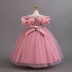 Dusty Rose glitter tulle girls ball gown with a satin bow and zipper at the back, off-shoulder ruffles and full ball gown skirt, designed for birthdays, weddings and flower girls.