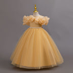 Gold glitter tulle girls ball gown with an off-shoulder ruffle neckline, pearl beaded waist and back bow, designed for birthdays, weddings and flower girls, view 2