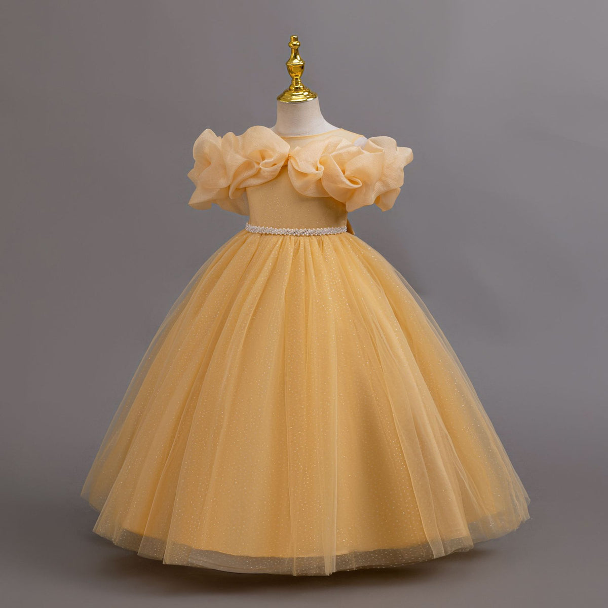 Gold glitter tulle girls ball gown with an off-shoulder ruffle neckline, pearl beaded waist and back bow, designed for birthdays, weddings and flower girls, view 2