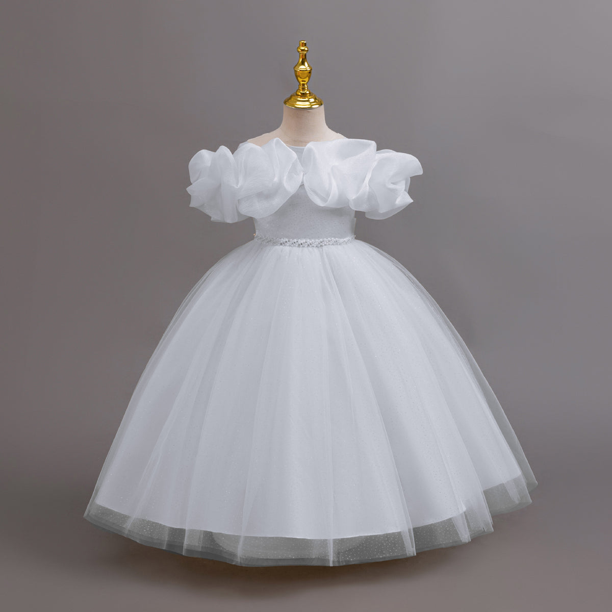 White glitter tulle girls ball gown with an off-shoulder ruffle neckline, pearl beaded waist and back bow, designed for birthdays, weddings and flower girls.