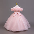 Pink tulle girls ball gown with ruffled off-shoulder neckline and back bow, designed for parties.