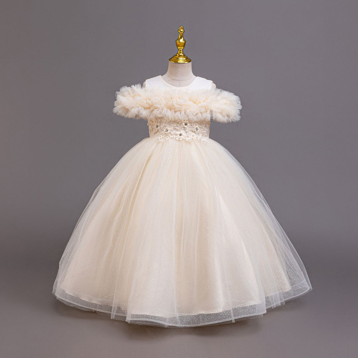 Champagne tulle girls ball gown front view with lace appliqué waist, designed for weddings.