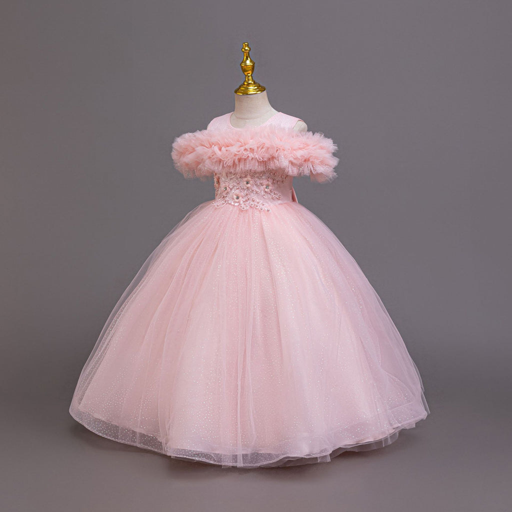 Pink tulle girls ball gown with off-shoulder ruffle neckline, beaded lace waist and back bow, designed for flower girls and birthdays.