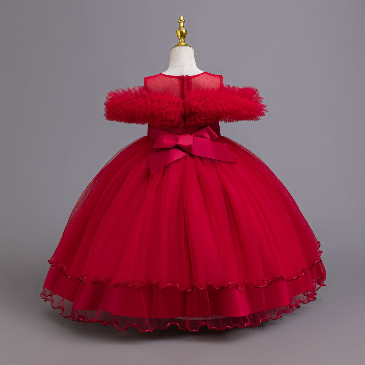 Red tulle girls ball gown with ruffled off-shoulder neckline, floral appliqué and satin bow back, designed for weddings and parties, view 3