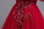 Red tulle girls ball gown with ruffled off-shoulder neckline, floral appliqué and satin bow back, designed for weddings and parties, view 6