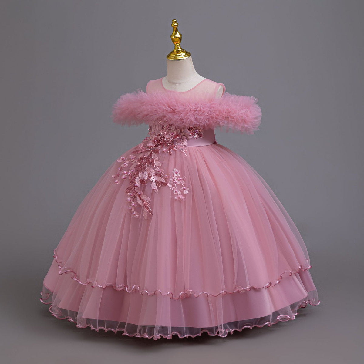 Mauve tulle girls ball gown with ruffled off-shoulder neckline, floral appliqué and satin bow back, designed for weddings and parties, view 2