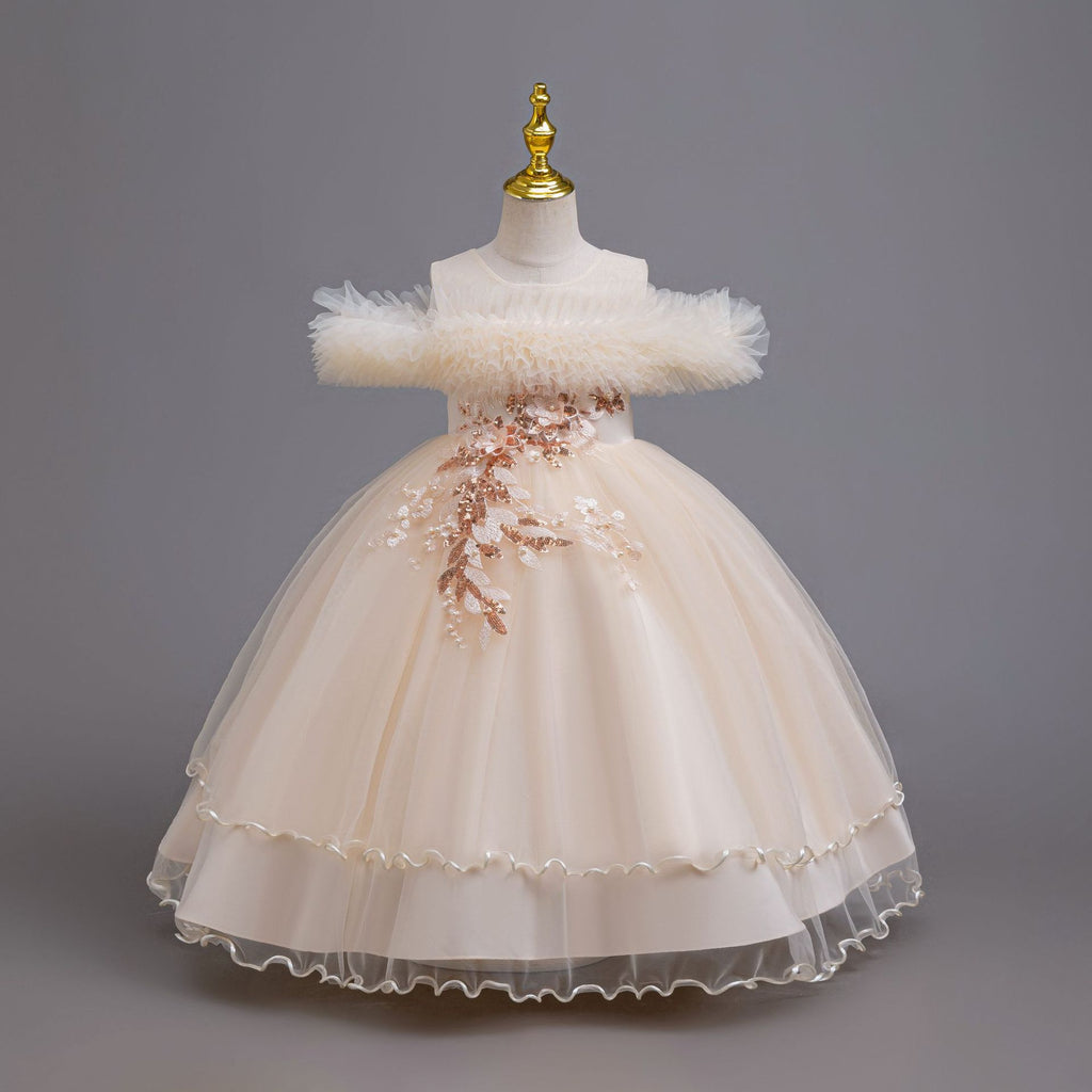 Champagne tulle girls ball gown with ruffled off-shoulder neckline, floral appliqué and satin bow back, designed for weddings and parties, view 3