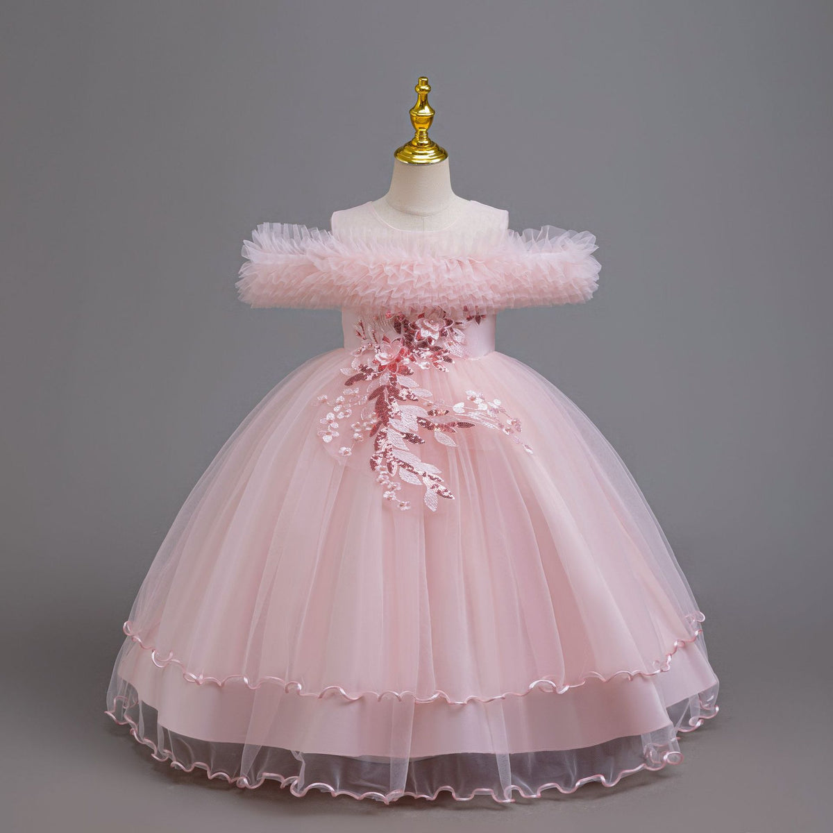 Pink tulle girls ball gown with ruffled off-shoulder neckline, floral appliqué and satin bow back, designed for weddings and parties, view 3