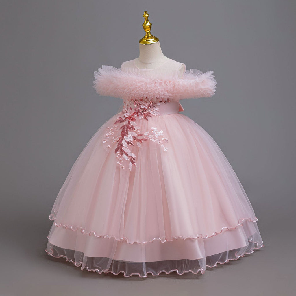 Pink tulle girls ball gown with ruffled off-shoulder neckline, floral appliqué and satin bow back, designed for weddings and parties.