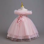 Pink tulle girls ball gown with ruffled off-shoulder neckline, floral appliqué and satin bow back, designed for weddings and parties.
