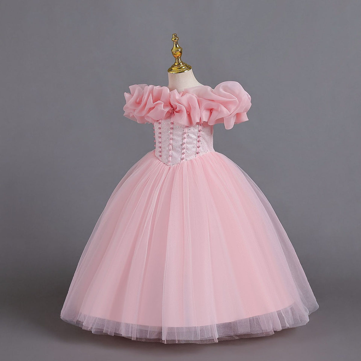 Pink tulle girls princess ball gown with off-shoulder organza ruffle sleeves and pearl-beaded bodice, designed for Christmas, weddings and flower girls.