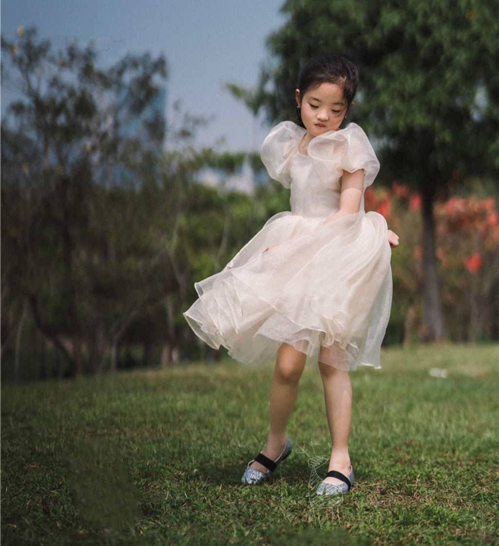 White organza girls dress back view with puff sleeves, designed for weddings and photoshoots.